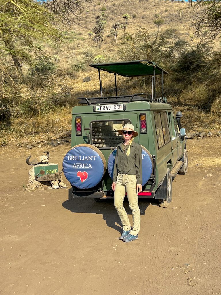 what to wear on safari for women, Safari outfit for women: khaki pants, olive green shirt, and sun hat